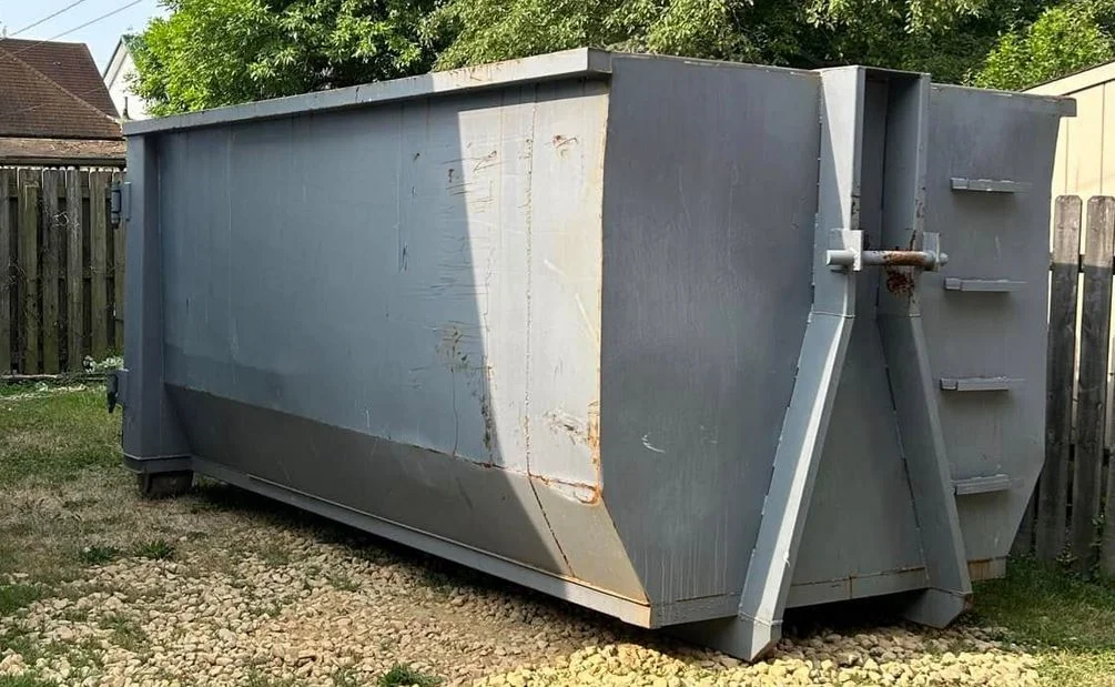 20 yard roll-off dumpster in driveway