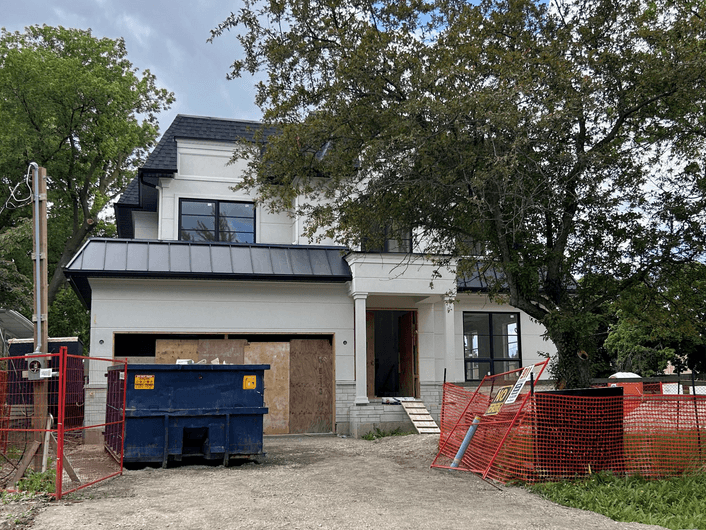 Residential dumpster in driveway