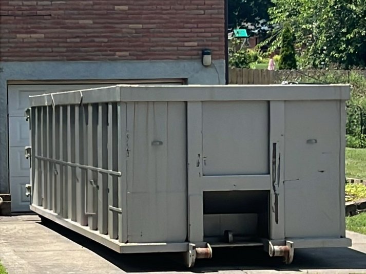 Residential dumpster in driveway