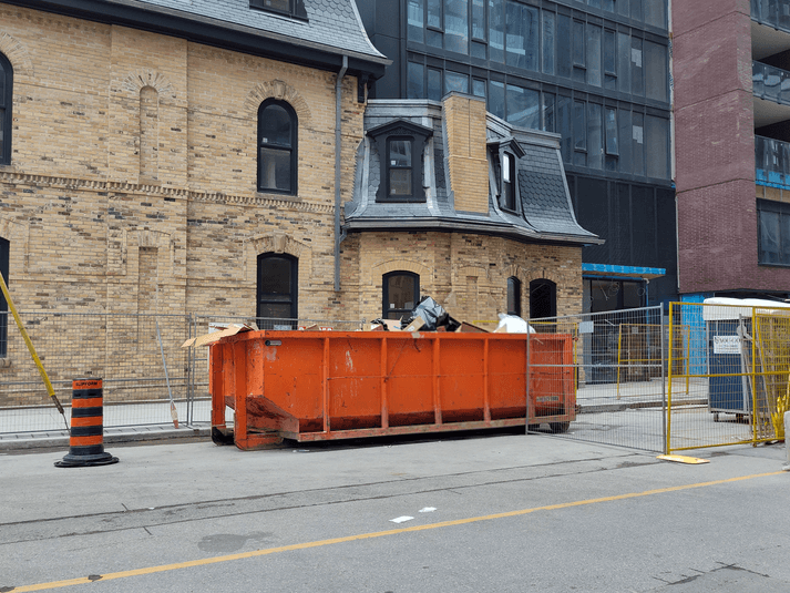 Construction dumpster scheduled drop-off for site waste management
