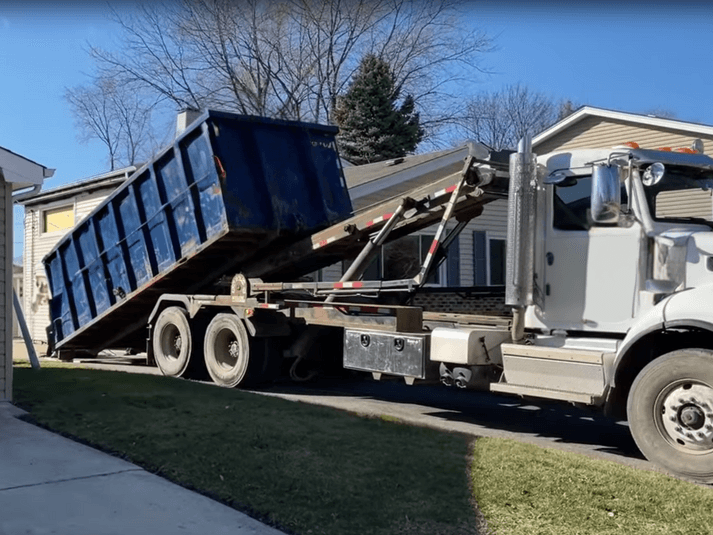 Drop off of roll-off bin at residence