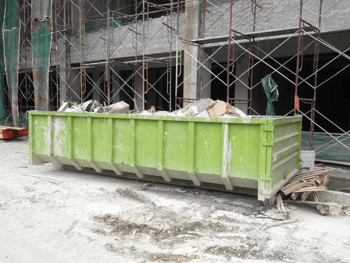 Large construction dumpster rental at high rise construction site