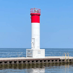 Small white and red lighthouse at Oakville Harbour on Lake Ontario